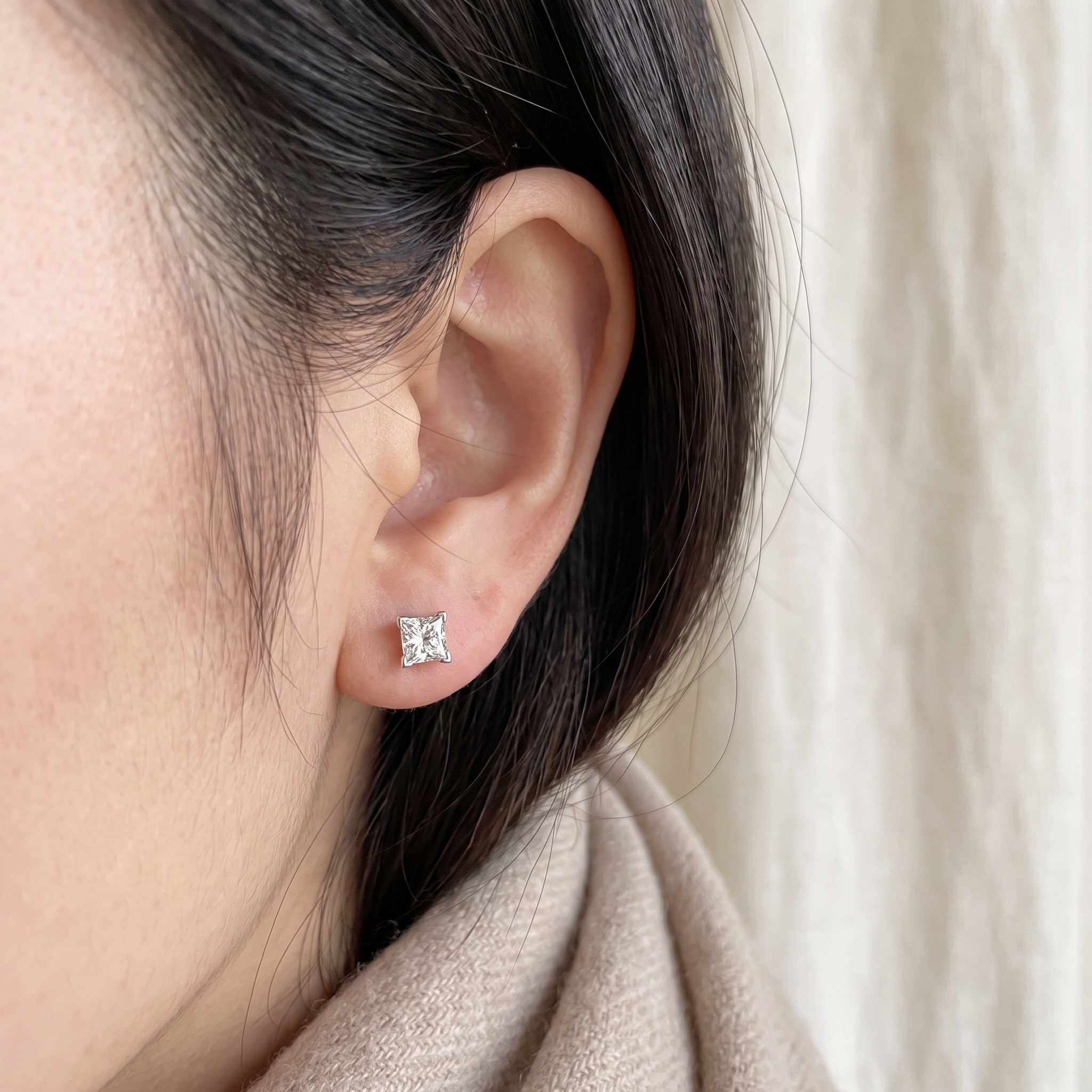 Princess Cut Diamond Stud Earrings — on ear lifestyle