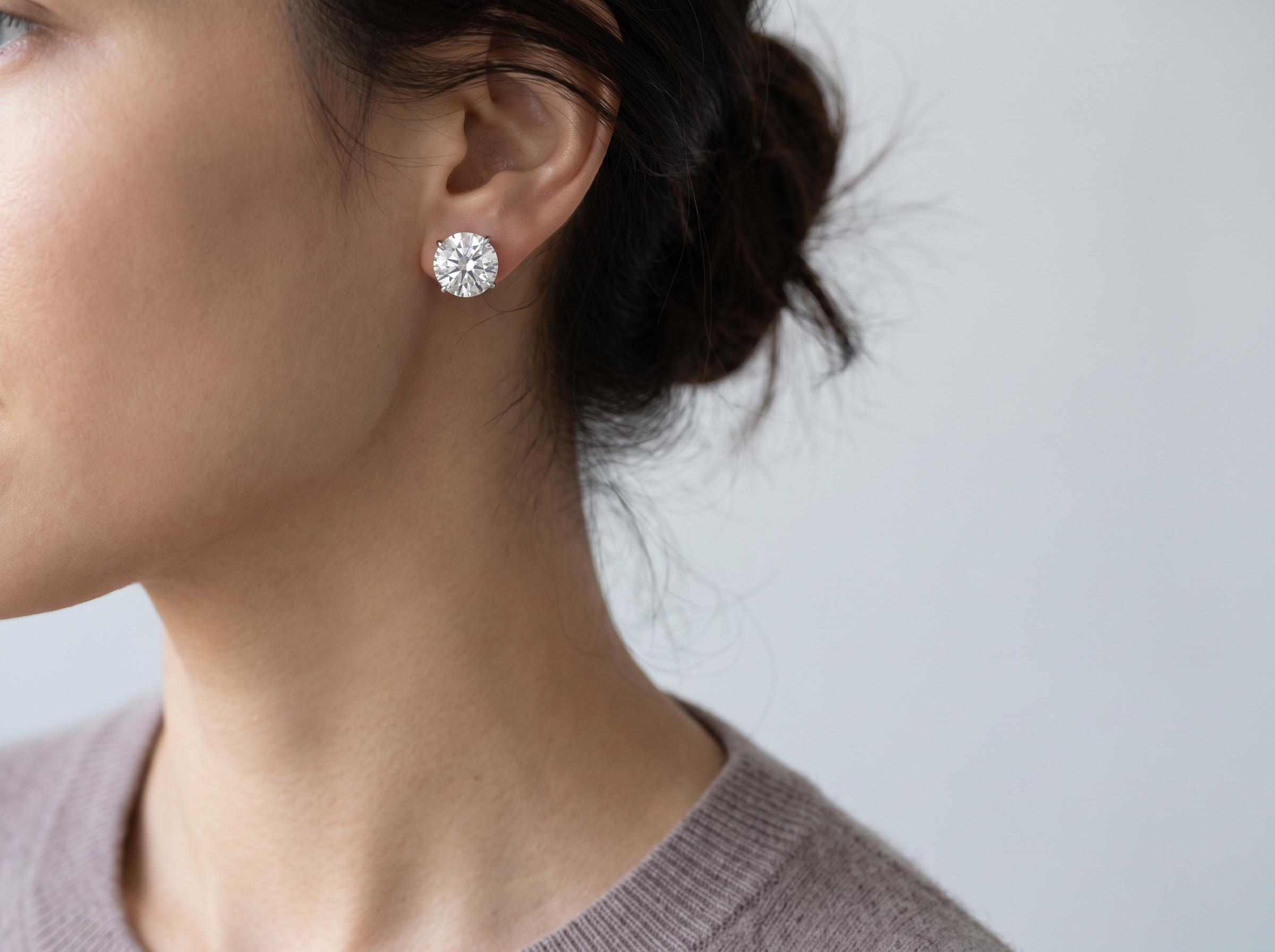 Round Brilliant Diamond Stud Earrings — on ear lifestyle